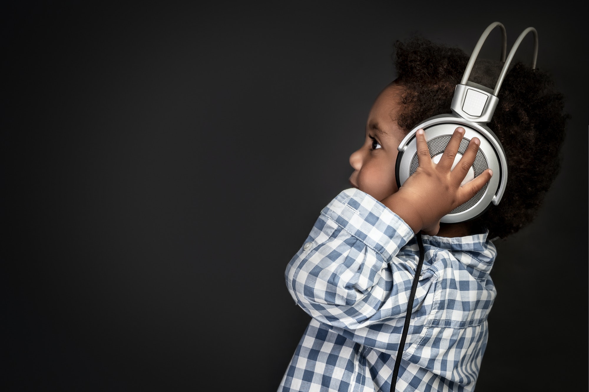 Little baby boy in headphones